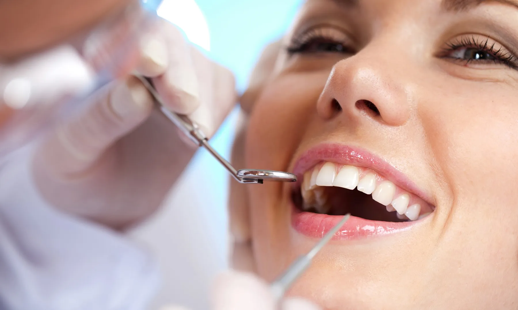 A patient smiling during a dental checkup